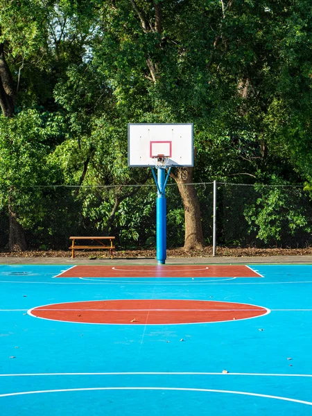 Empty field with basketball stand