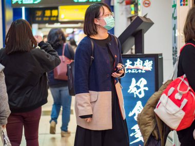 Passengers wearing face mask in street in Taipei,Taiwan.