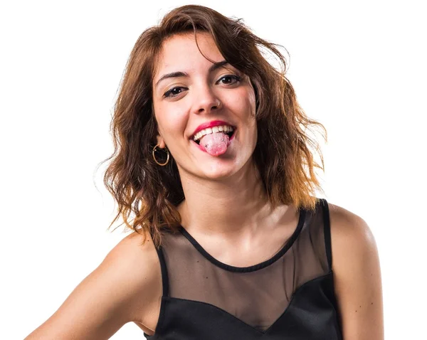 Linda chica sacando su lengua —  Fotos de Stock