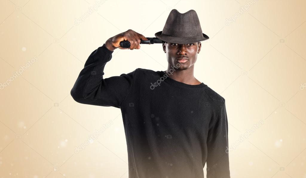 Black man holding a pistol