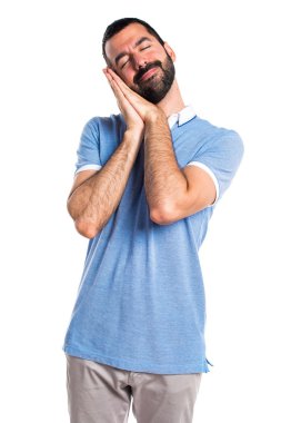 Adam mavi gömlek uyku jest yapıyor