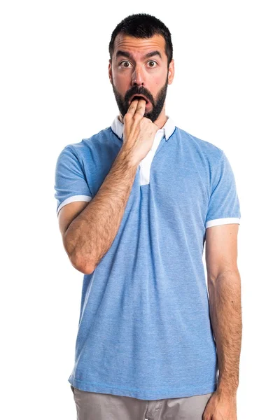 Man met blauwe shirt doen braken gebaar — Stockfoto