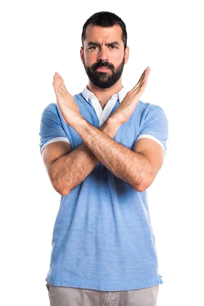 Hombre con camisa azul haciendo NO gesto —  Fotos de Stock