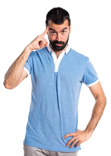 Hombre con camisa azul pensando — Foto de Stock