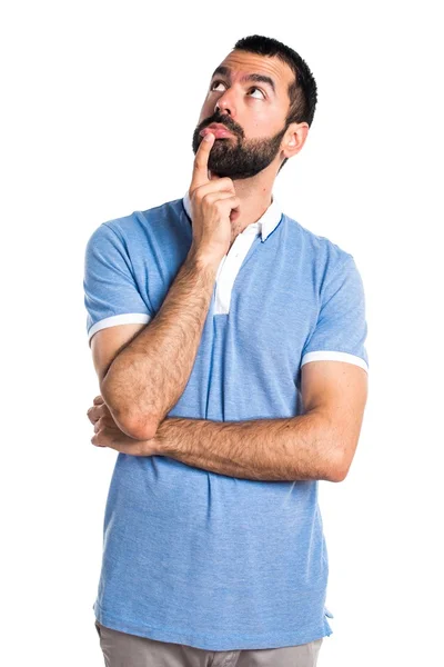 Hombre con camisa azul pensando —  Fotos de Stock