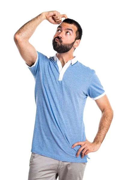Człowiek z niebieską koszulę, mając wątpliwości — Zdjęcie stockowe
