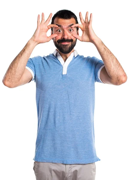 Man with blue shirt showing something — Stock Photo, Image