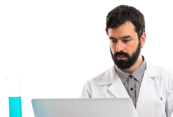 Scientist man working with his laptop — Stock Photo, Image