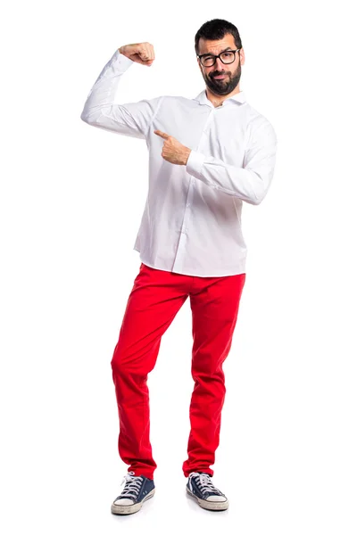 Hombre guapo con gafas haciendo un gesto fuerte —  Fotos de Stock