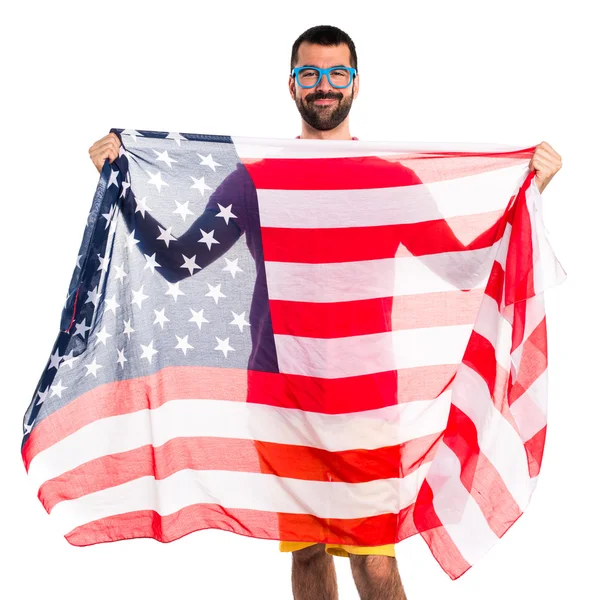 色彩鲜艳的衣服，拿着美国国旗的人 — 图库照片
