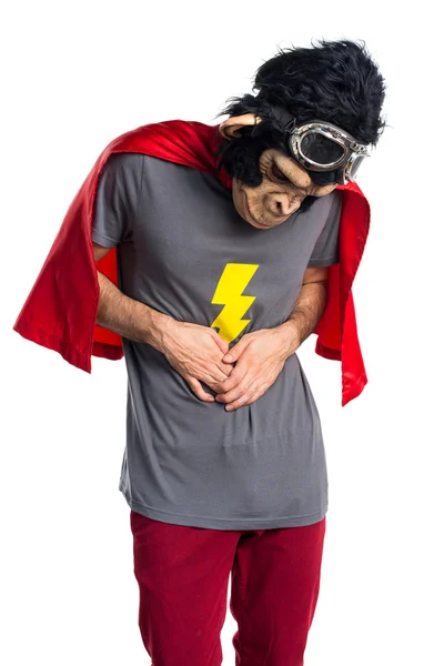 Homem macaco super-herói com dor de estômago — Fotografia de Stock