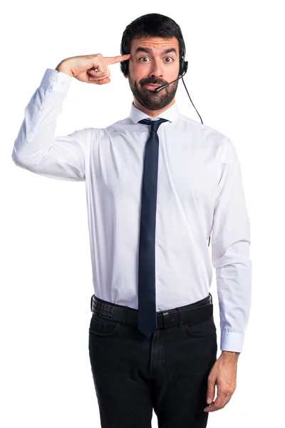 Joven con un auricular haciendo un gesto loco — Foto de Stock