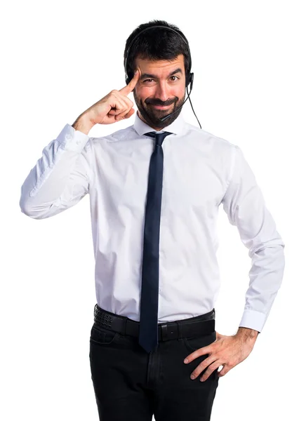 Young man with a headset thinking — Stock Photo, Image