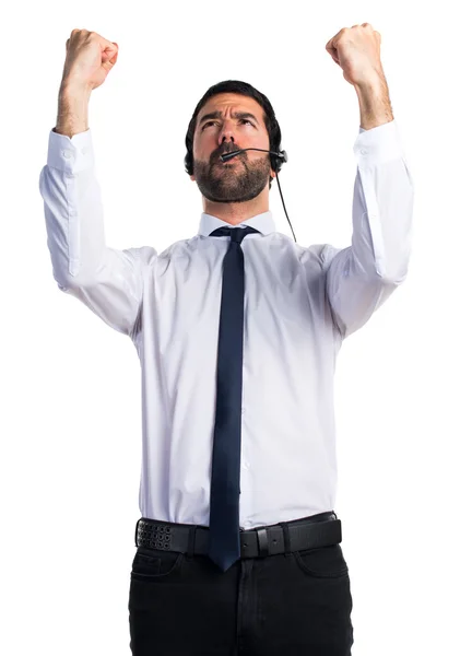 Fortunato giovane uomo con un auricolare — Foto Stock