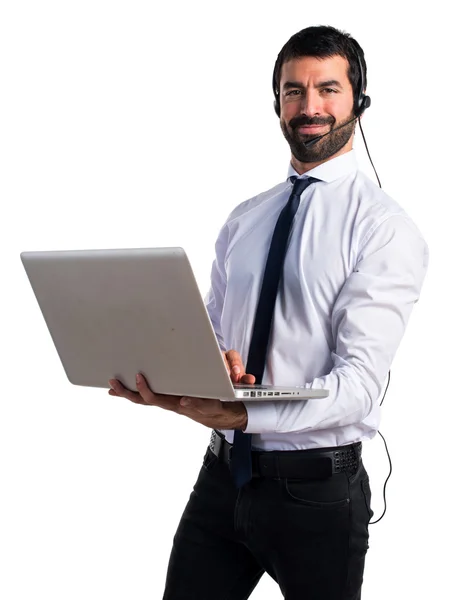 Handsome telemarketer man with laptop — Stock Photo, Image