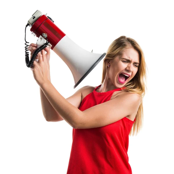 Blond meisje schreeuwen door megafoon — Stockfoto