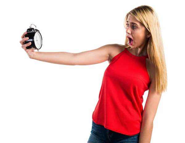 Blonde girl holding vintage clock — Stock Photo, Image