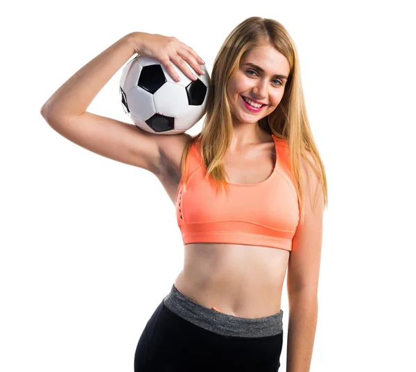 Menina loira bonita segurando uma bola de futebol — Fotografia de Stock