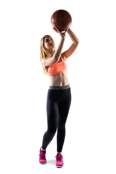 Blonde girl playing basketball — Stock Photo, Image