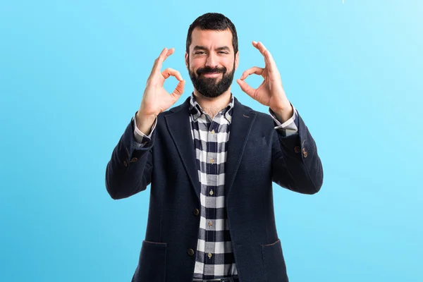 Handsome man making OK sign — Stock Photo, Image