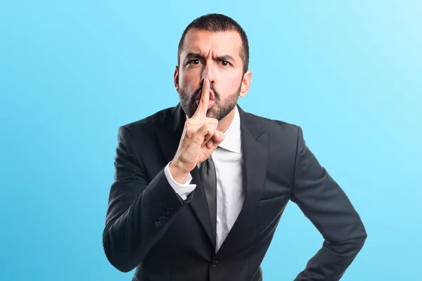 Businessman making silence gesture — Stock Photo, Image