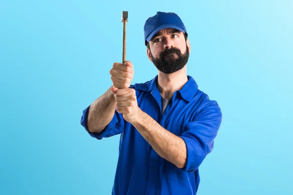 Plumber holding a hammer — Stock Photo, Image