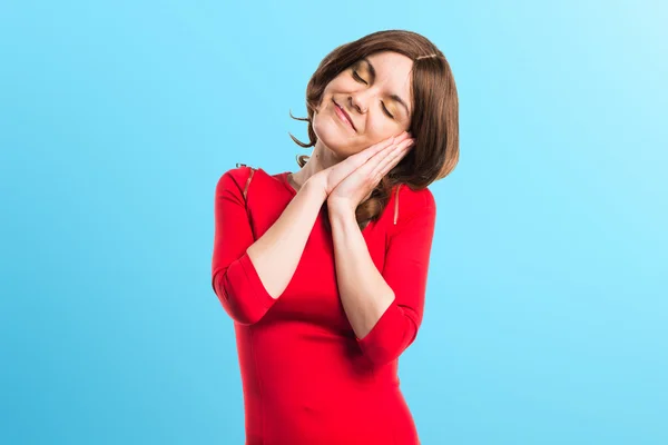 Brunette woman doing sleep gesture — Stock Photo, Image