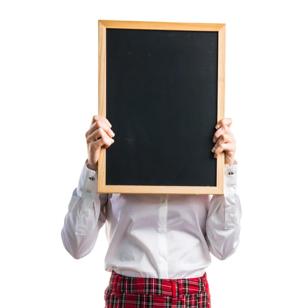 Student tjej håller en tom plakat — Stockfoto