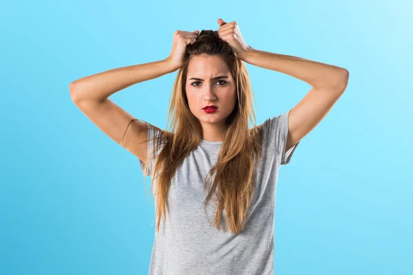 Pretty blonde woman with grey shirt — Stock fotografie