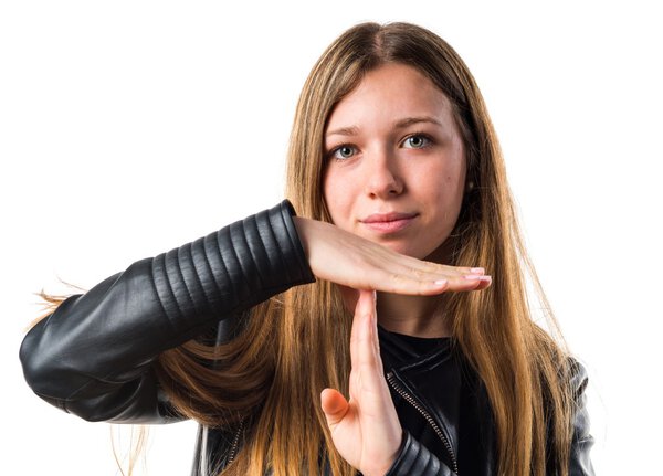Teen girl making time out gesture