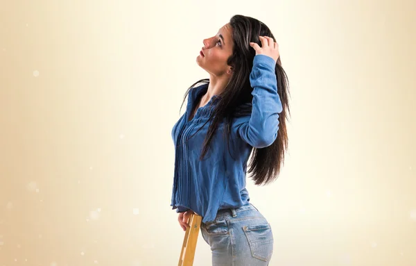 Model woman in studio with chair — Stock Photo, Image