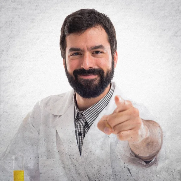 Scientist man pointing to the front