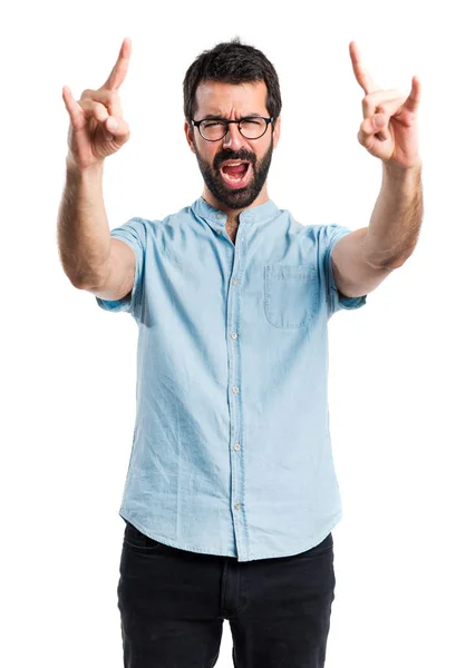 Bonito homem fazendo gesto chifre — Fotografia de Stock