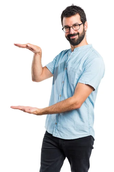 Handsome man holding something — Stock Photo, Image