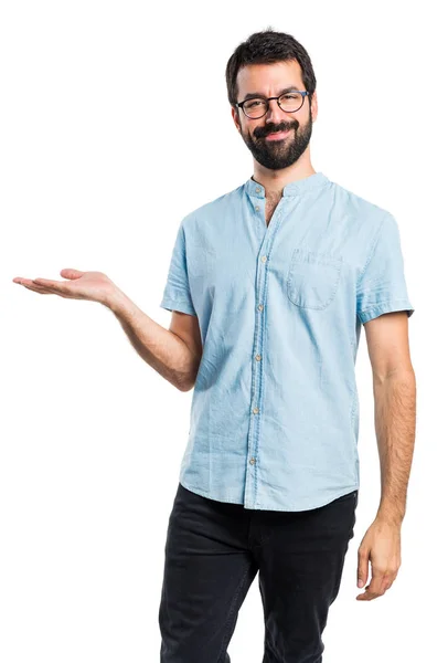 Handsome man holding something — Stock Photo, Image