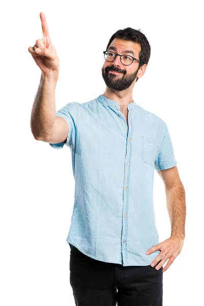 Hombre guapo con gafas azules tocando en pantalla transparente —  Fotos de Stock