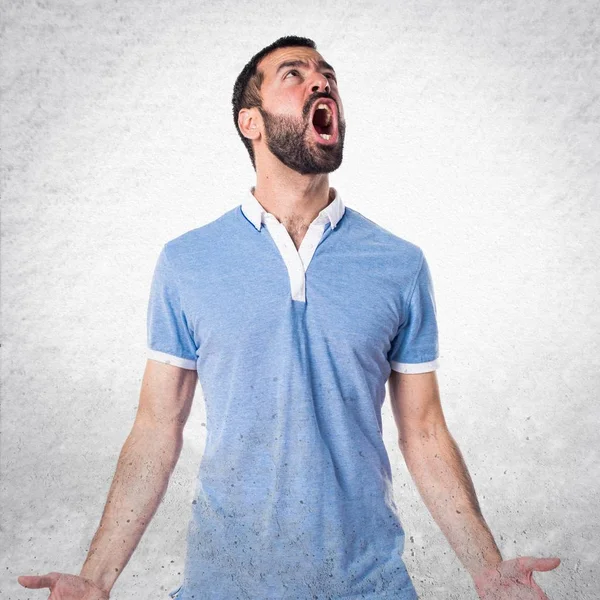 stock image Man with blue shirt shouting