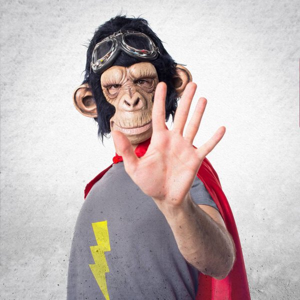 Superhero monkey man counting five