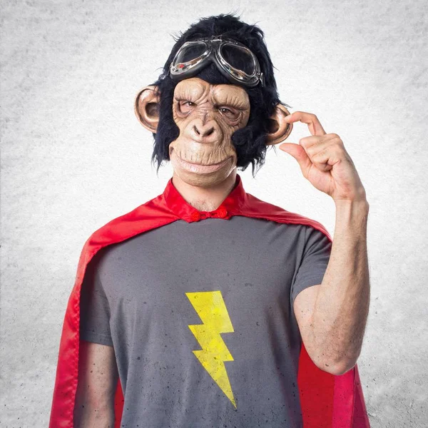 Superhero monkey man doing tiny sign — Stock Photo, Image