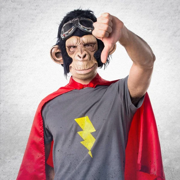 Superhero monkey man doing bad signal