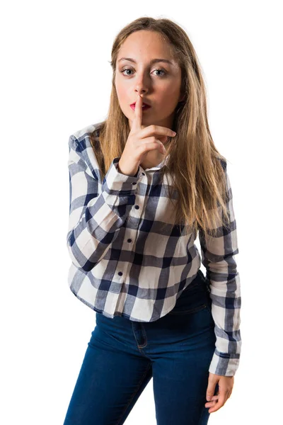 Blonde teen girl making silence gesture — Stock Photo, Image