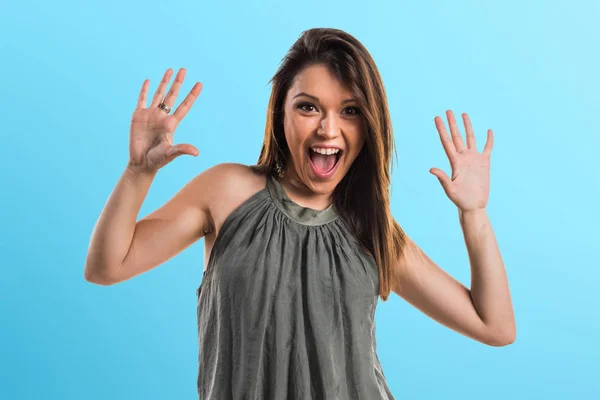 Young girl doing surprise gesture — Stock Photo, Image