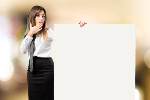 Businesswoman holding placard over white background — Stock Photo, Image