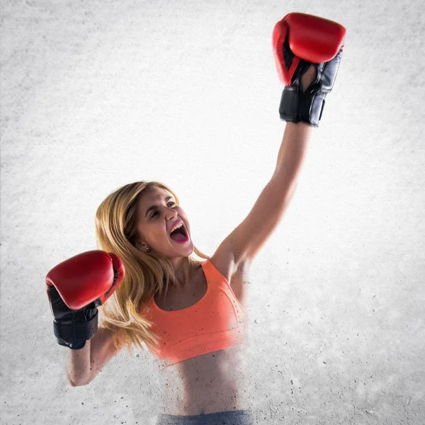 Lucky girl with boxing gloves — Stock Photo, Image
