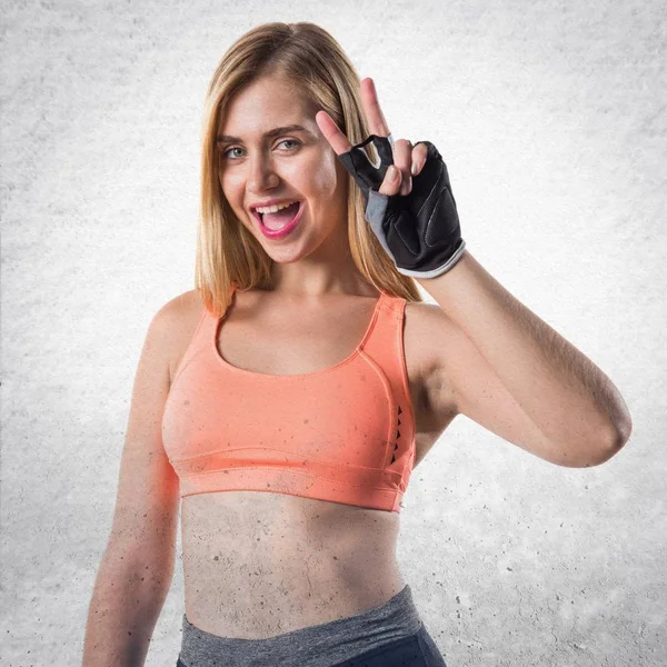 Sport woman doing victory gesture