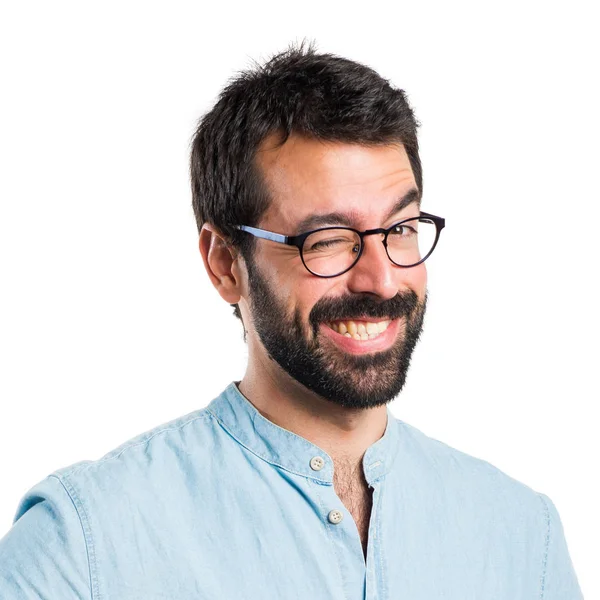 Hombre guapo con gafas azules guiñando el ojo —  Fotos de Stock