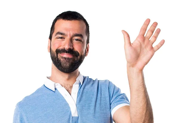 Hombre con camisa azul saludando — Foto de Stock