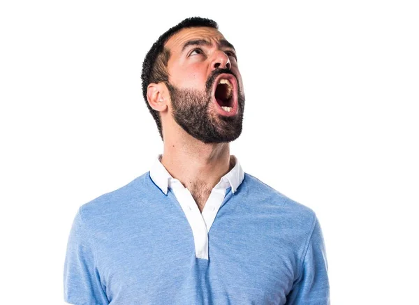 Hombre con camisa azul gritando — Foto de Stock