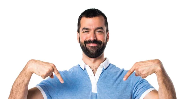 Man with blue shirt pointing down — Stock Photo, Image