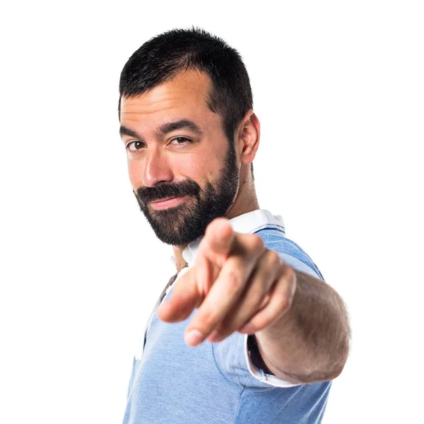 Man with blue shirt pointing to the front — Stock Photo, Image